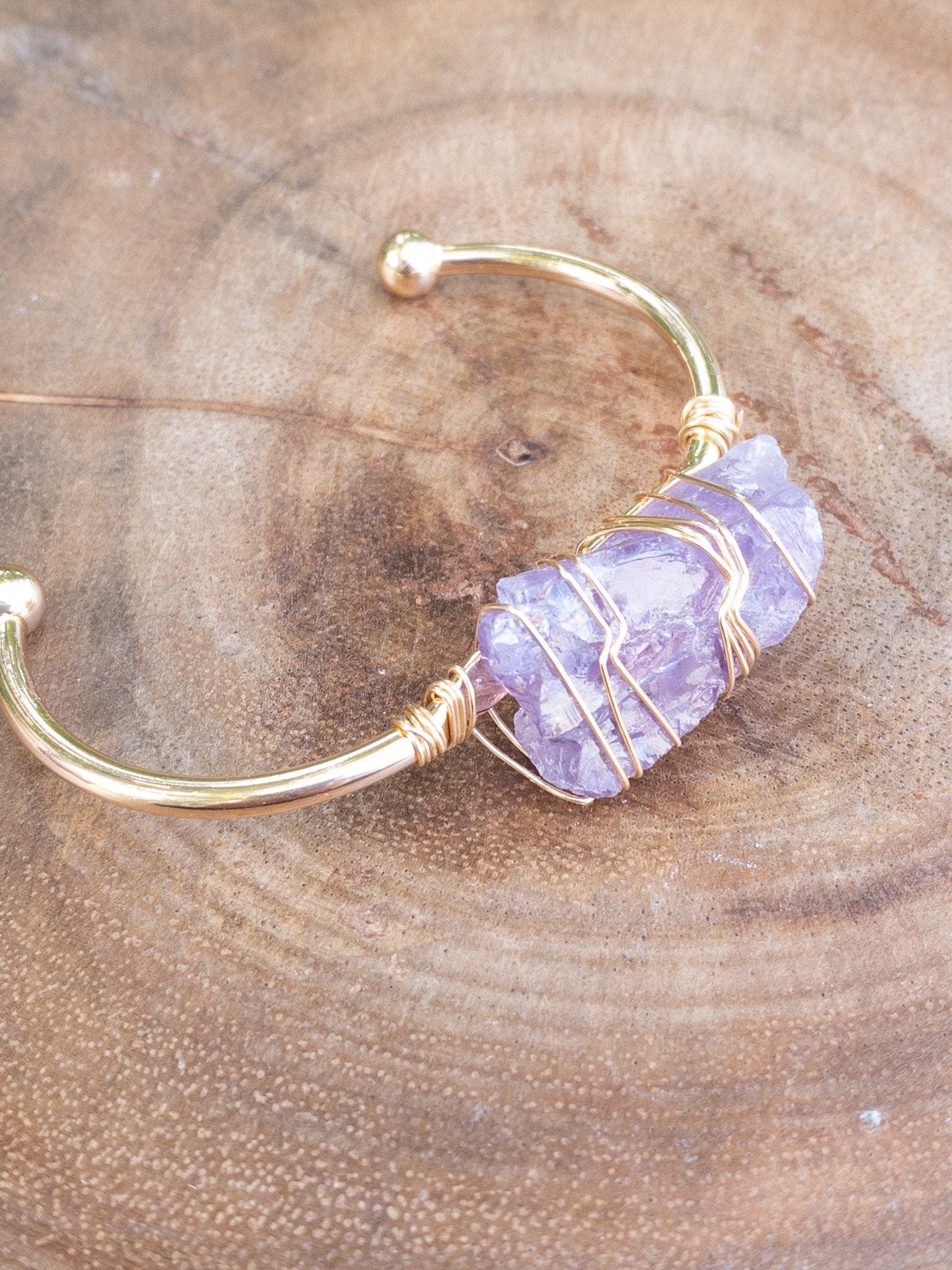 Adjustable rose quartz bracelet showing size flexibility - handmade healing crystal jewelry