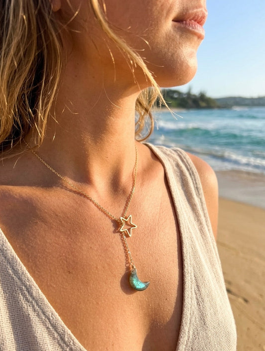 Celestial lariat necklace detail showing labradorite crescent moon and open star design