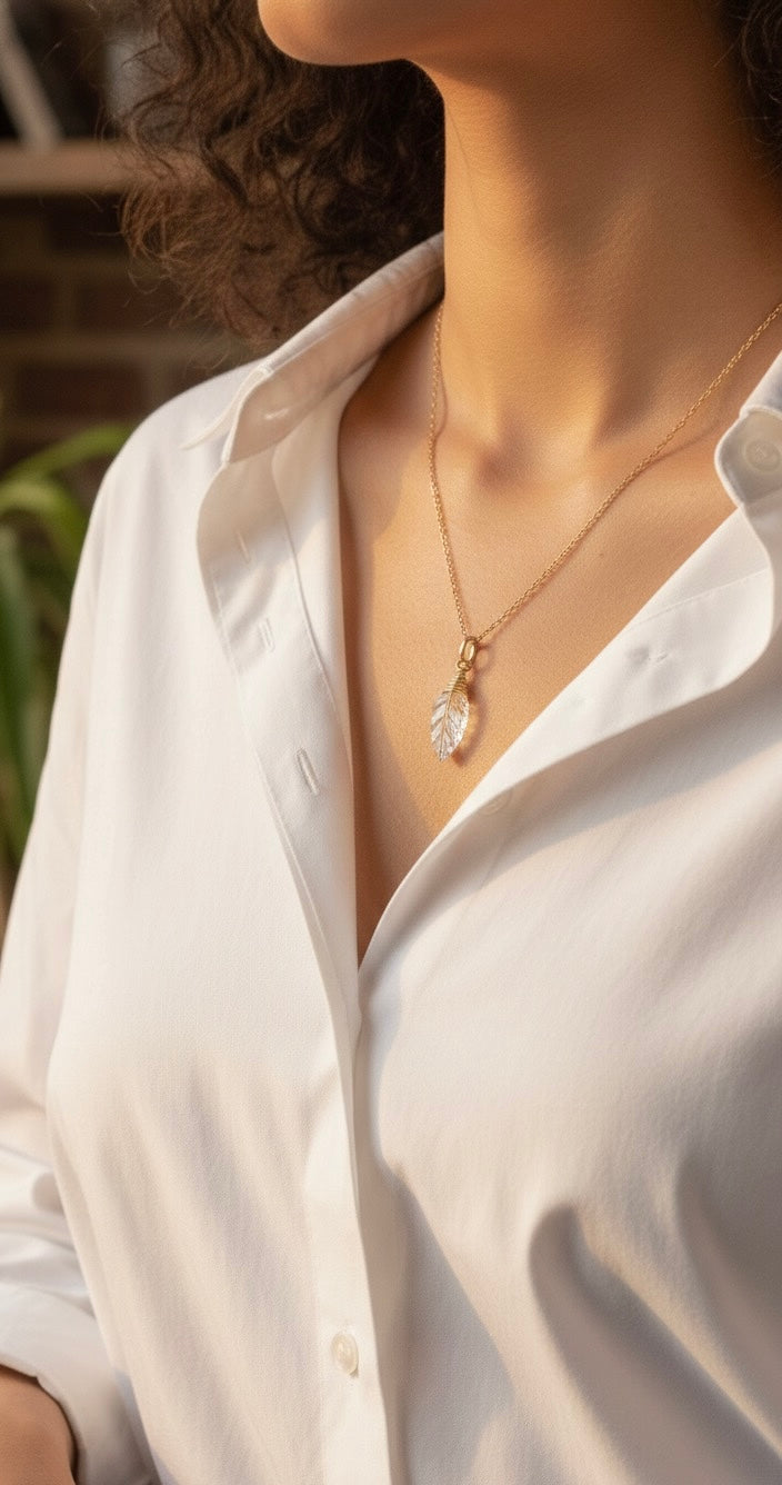 Clear quartz leaf necklace showing unique crystal clarity - artisan wire wrapped pendant
