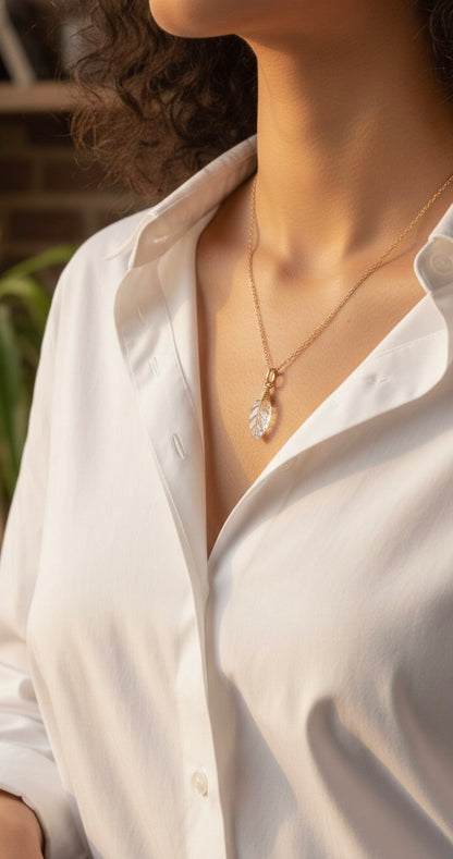Clear quartz leaf necklace showing unique crystal clarity - artisan wire wrapped pendant