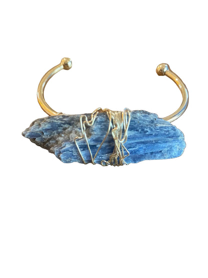 Close up of kyanite gemstone in wire wrapped cuff bracelet