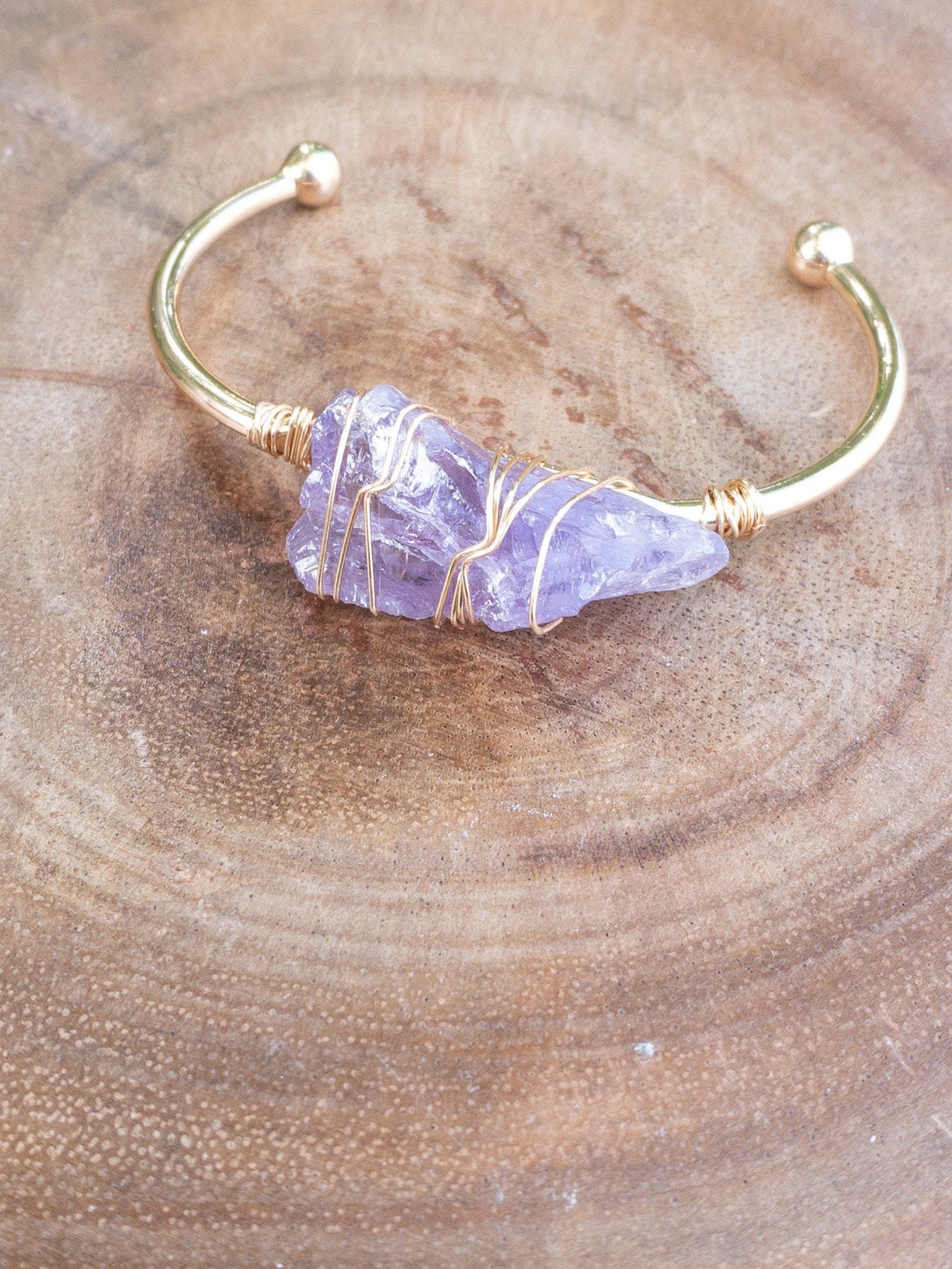 Close up of rose quartz gemstone wire wrapped bracelet showing tarnish resistant copper wire detail