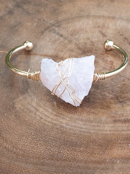 Handcrafted rose quartz bracelet detail showing copper wire wrapping technique - one of a kind jewelry