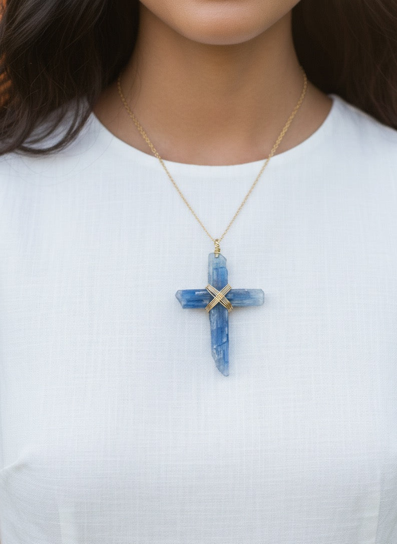 Kyanite cross pendant necklace close up - natural healing crystal jewelry