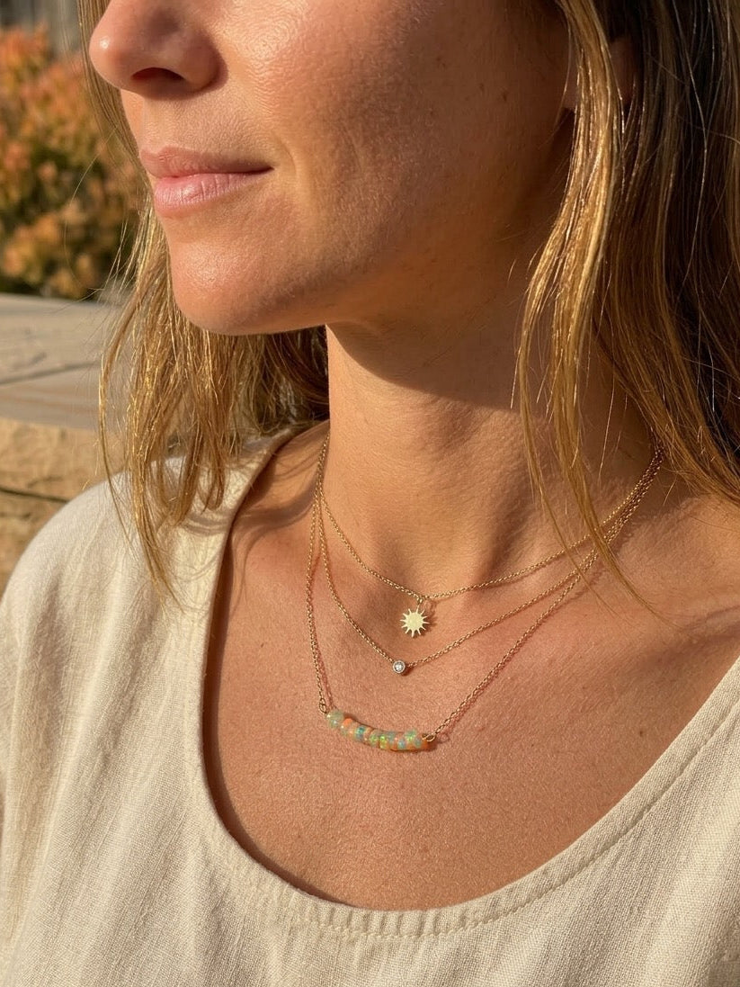 Natural opal stone pendant close-up, wire wrapped gemstone necklace