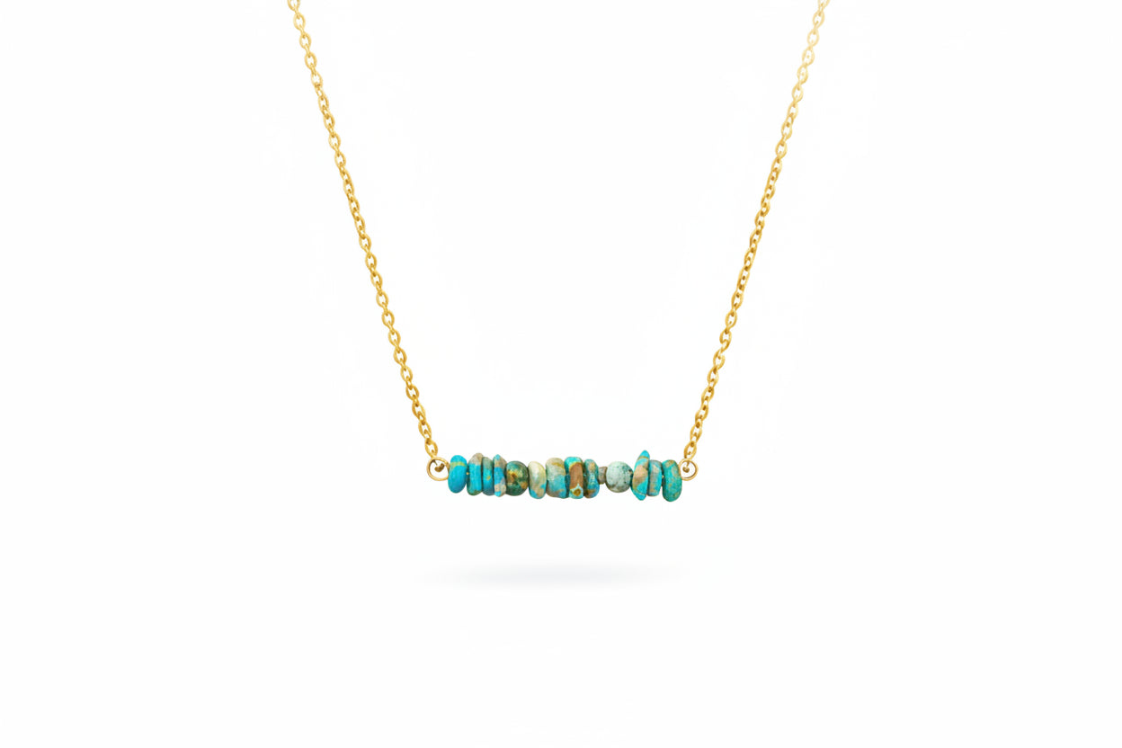Natural turquoise bar necklace close-up showing genuine stone beads and gold chain detail