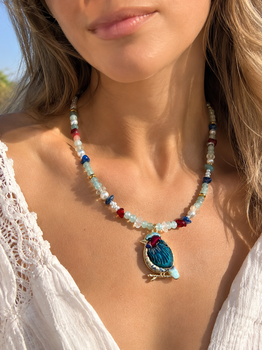 One-of-a-kind beaded pearl necklace with detailed bird pendant
