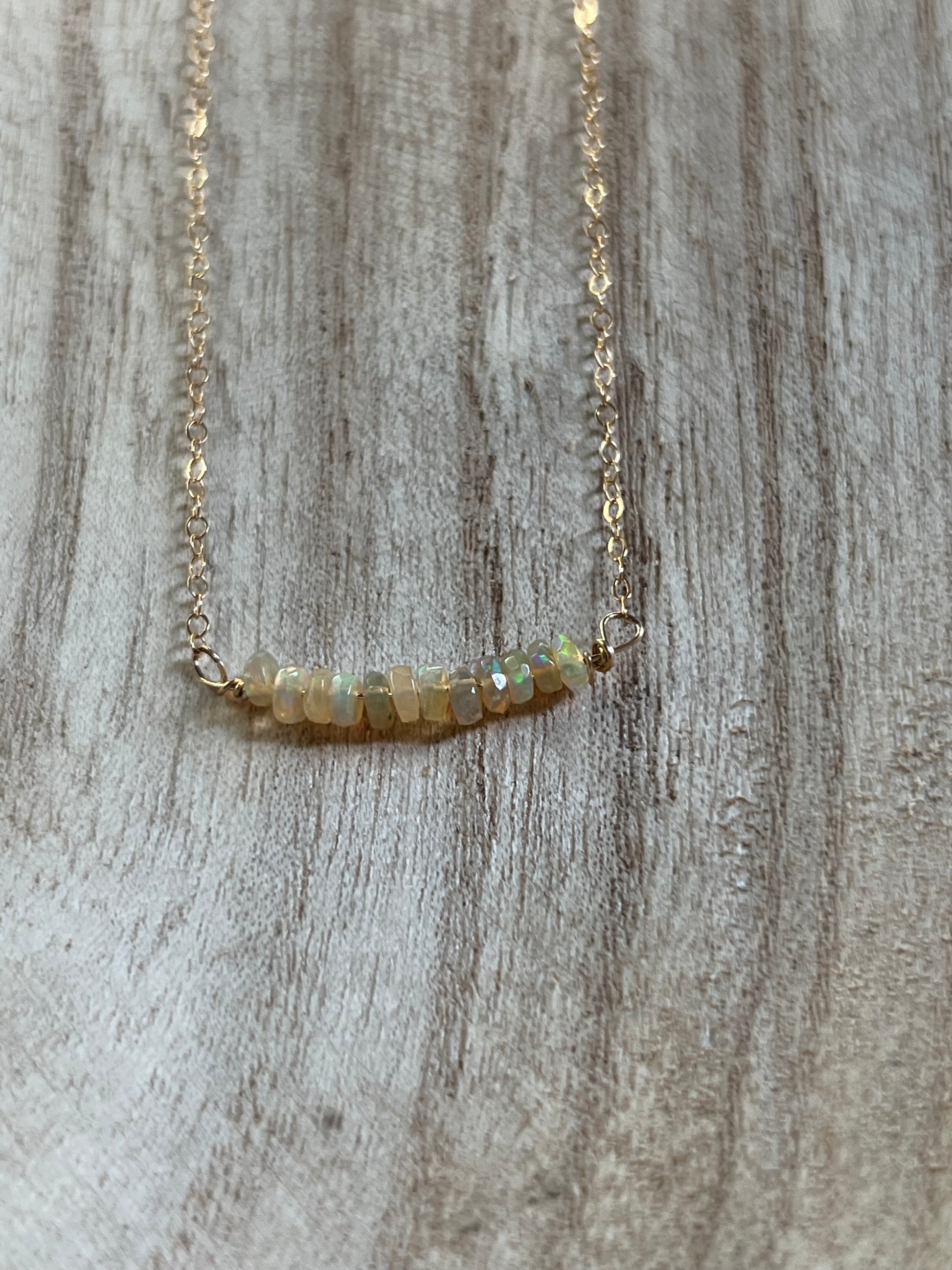 Opal necklace on model, delicate gold filled gemstone jewelry