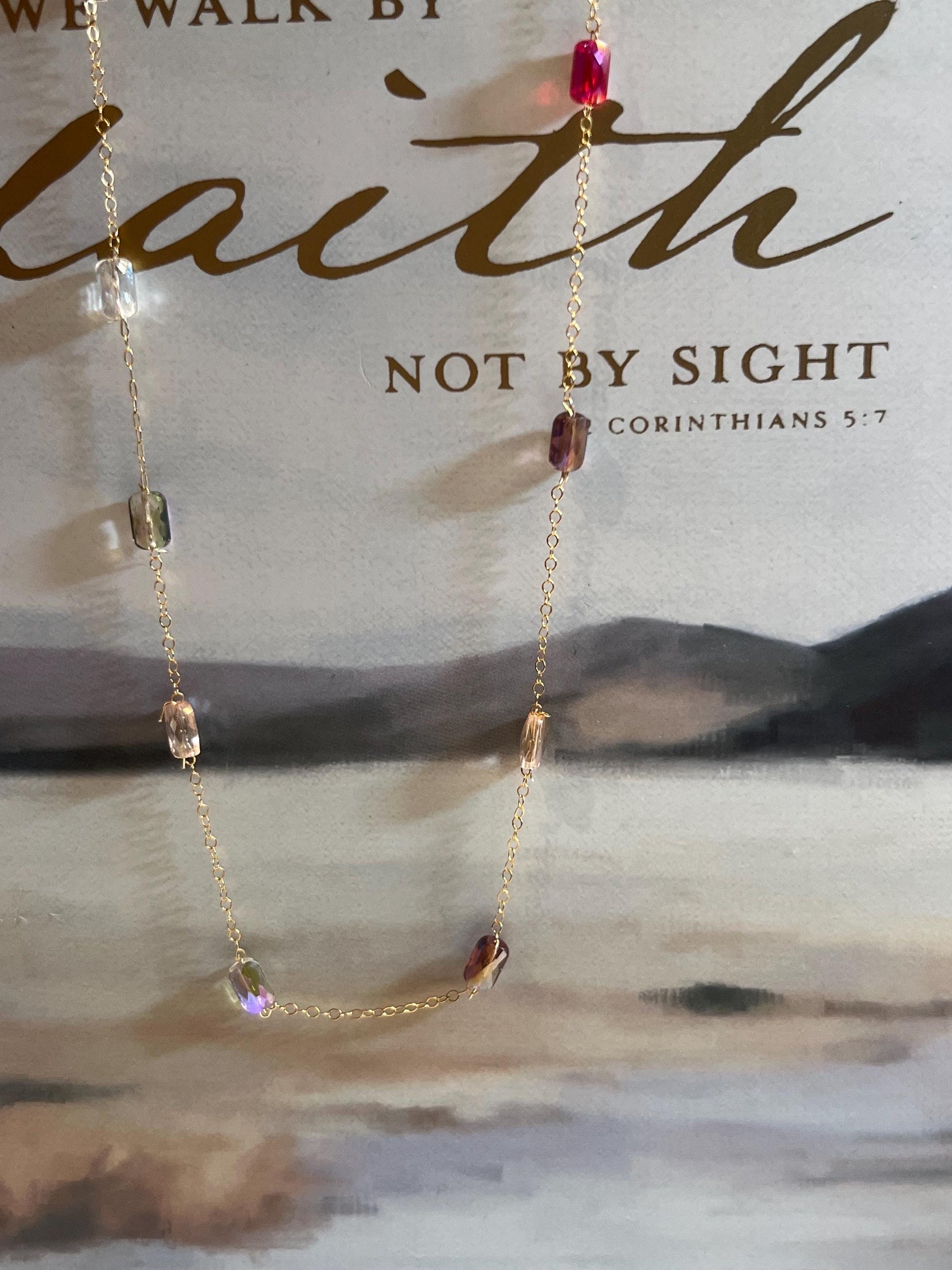 Rainbow crystal necklace on model - minimalist layering jewelry