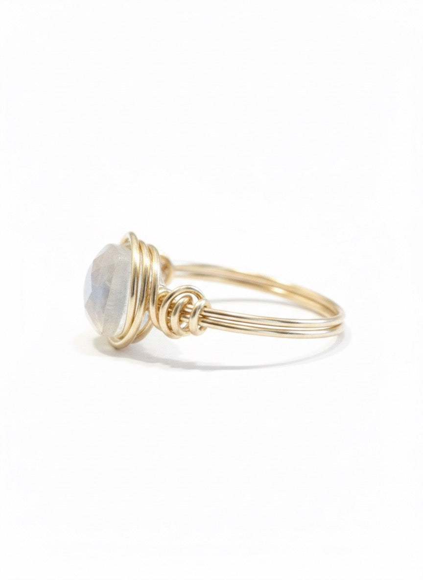 Rainbow moonstone ring close up - AAA moonstone cushion cut with blue flash