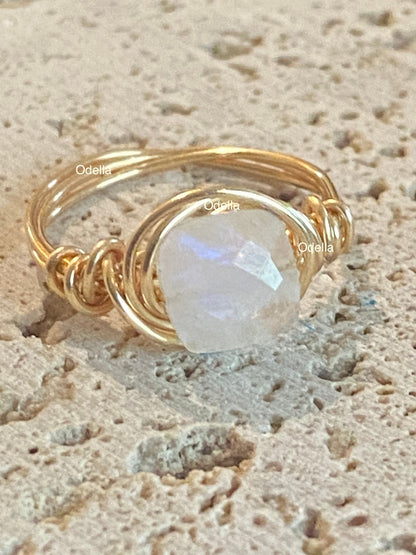 Rainbow moonstone ring on model - handmade wire wrapped gemstone ring