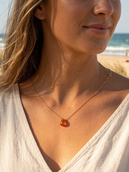 Yellow onyx gemstone necklace detail showing natural golden stone and delicate wire wrapping