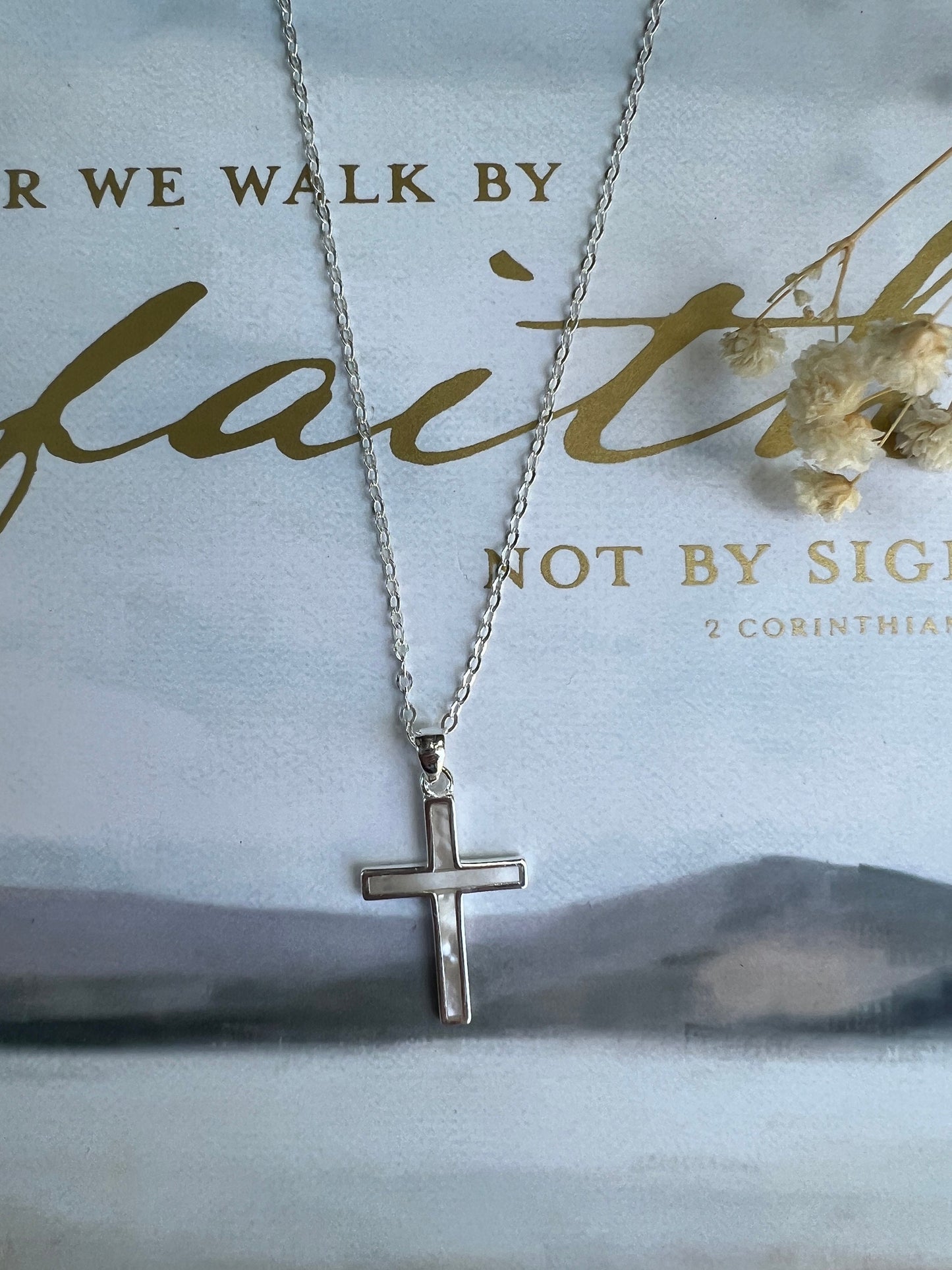 sterling silver cross necklace with opalescent mother of pearl detail